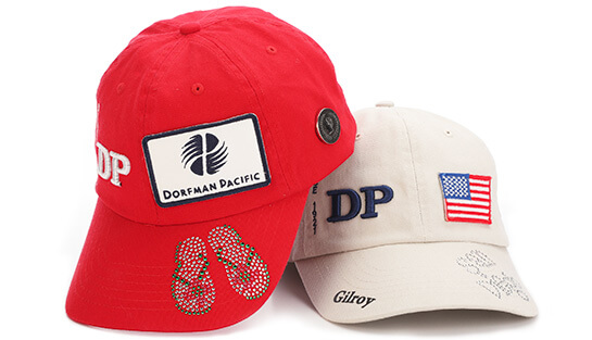 Two caps with patches, rhinestones, pins, and other embroidered artwork