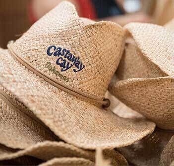 Castaway Cay logo on the front of straw hats