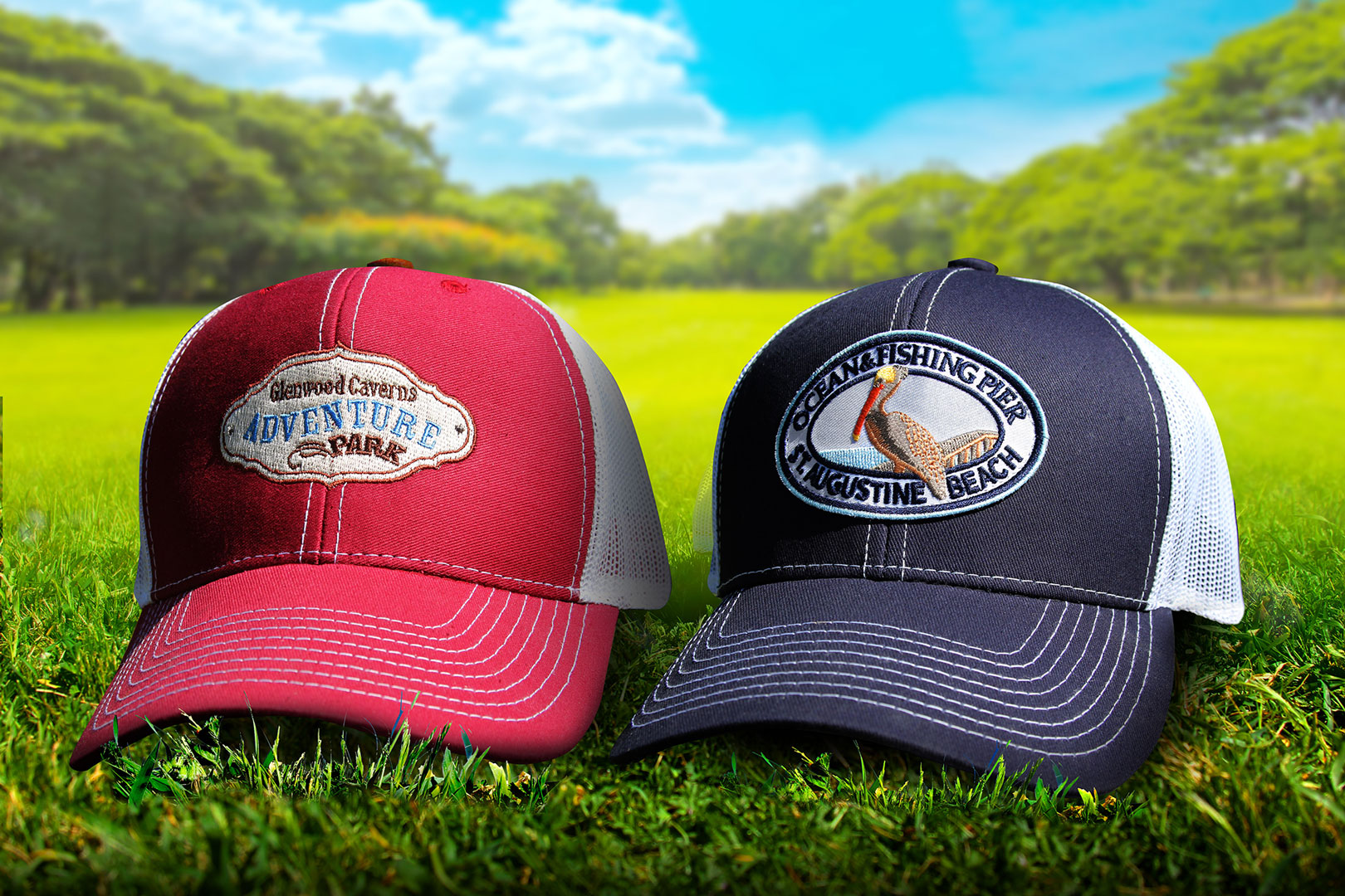 A red and blue ball cap resting on green grass on a sunny day